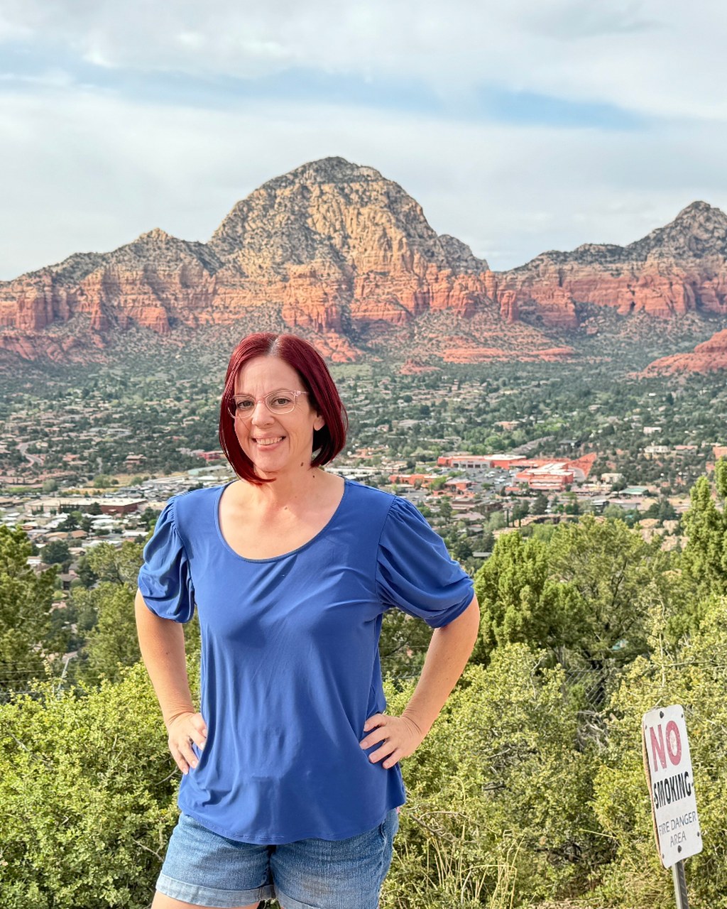 Julie standing in front of the Sedona red rocks